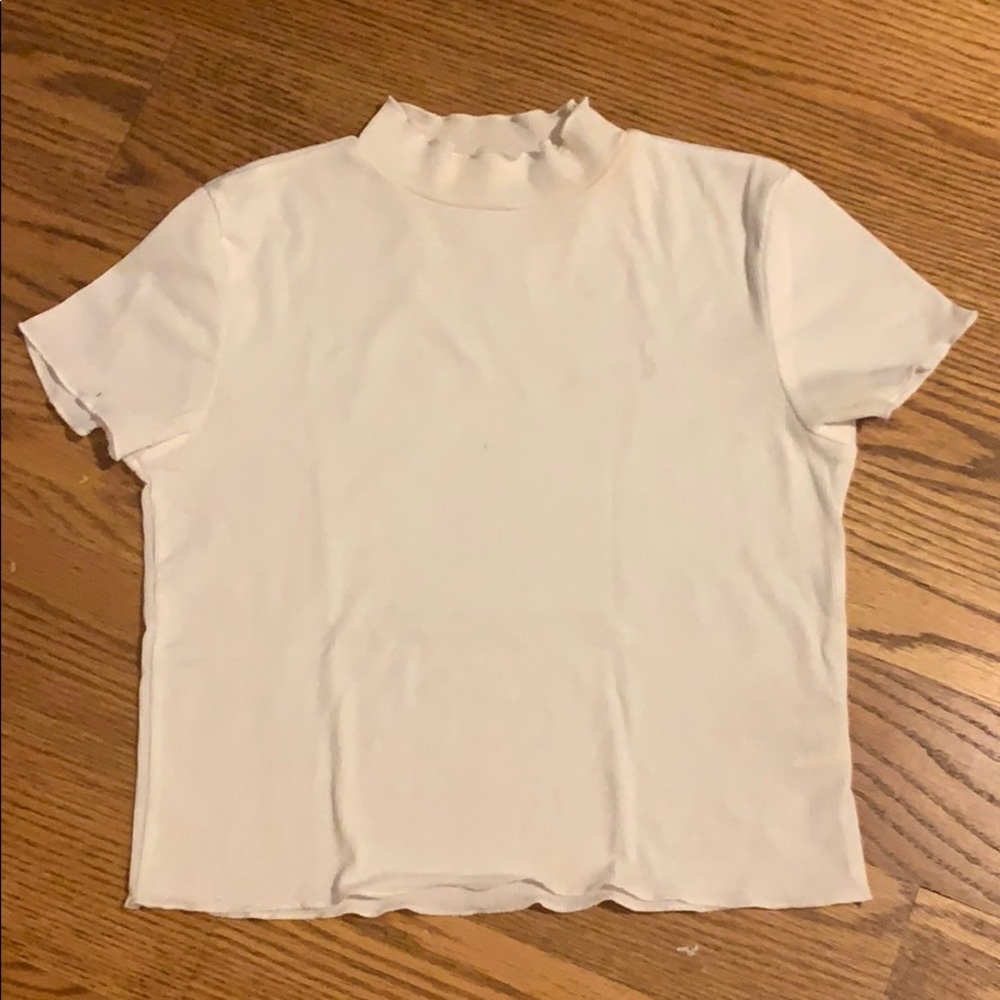 White tight fitting shirt with mock neck